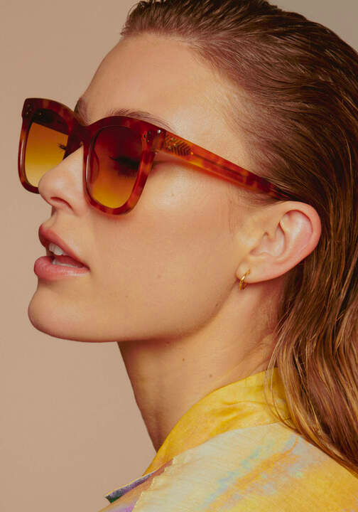 KREWE - ADELE | Amaro + Custom Vanity Tint Handcraafted, luxury oversized orange sunglasses with custom orange tinted lenses womens model campaign | Model: Keke
