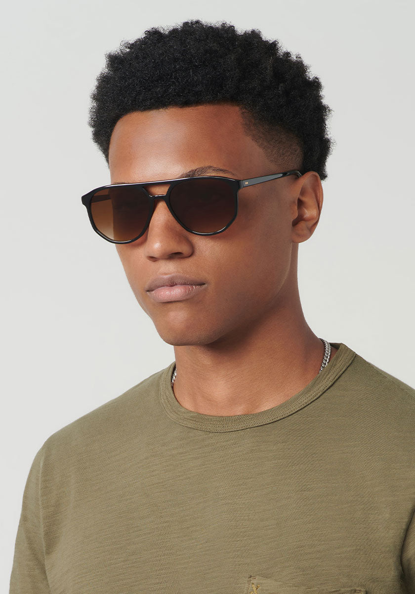BRANDO | Black + Black Tea Handcrafted, luxury black acetate KREWE sunglasses mens model | Model: Brandon