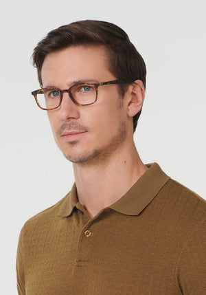 KREWE CARLYLE | Heron Handcrafted, luxury brown acetate eyeglasses mens model | Model: Tom