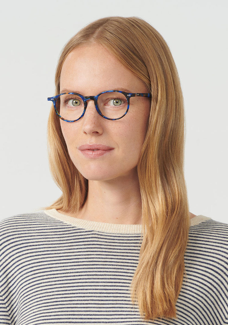 CARSON II | Matte Blue Steel Handcrafted, luxury blue tortoise round KREWE eyeglasses womens model | Model: Annelot