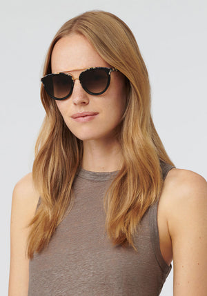 CLIO NYLON | Crema to Black 24K Handcrafted, luxury brown and cream acetate KREWE oversized sunglasses womens model | Model: Annelot