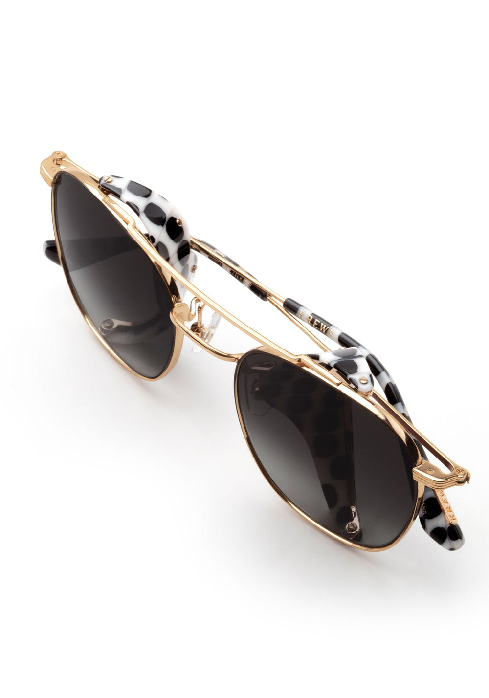 EARHART BLINKER | Matte Black + 24K Domino Handcrafted, luxury black and white spotted acetate KREWE sunglasses
