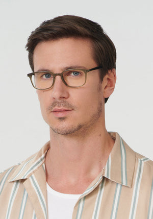 KREWE CARLYLE | Sage + Black Handcrafted, luxury green acetate eyeglasses mens model | Model: Tom