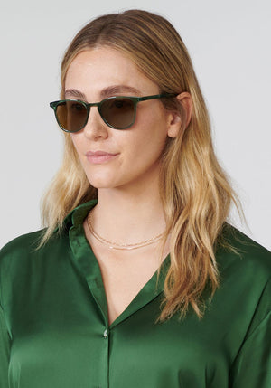 OLIVIER | Bottle Green handcrafted, luxury green acetate KREWE sunglasses womens model | Model: Brooke